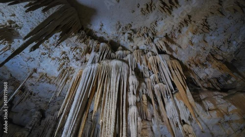 Wallpaper Mural Majestic cavern ceiling with dense stalactite formations, natural formations, geological wonder, and limestone textures in underground environment. Torontodigital.ca