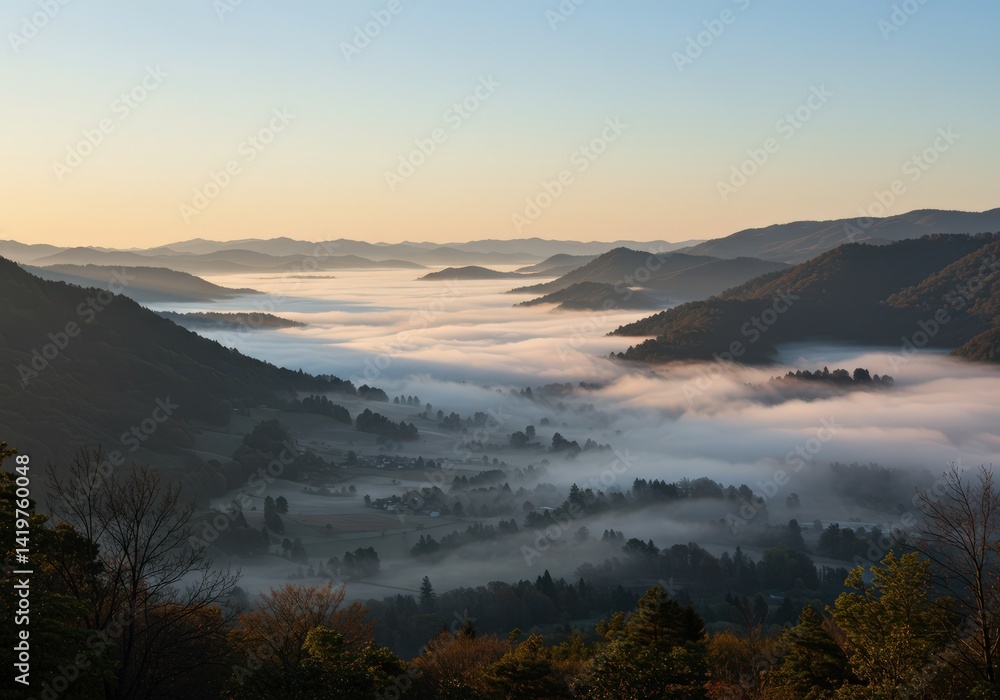Obraz premium Early morning captures the mountain valley filled with a blanket of fog under a bright sky.