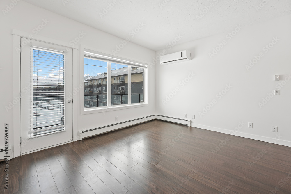 Fototapeta premium Large empty room with a window and a heater