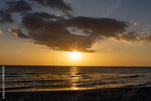 Sunsets Over Beaches, Palm Trees and Oceans