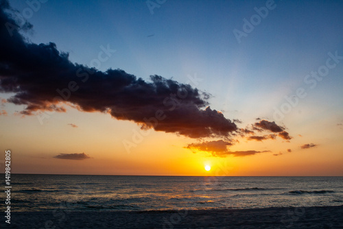 Sunsets Over Beaches, Palm Trees and Oceans