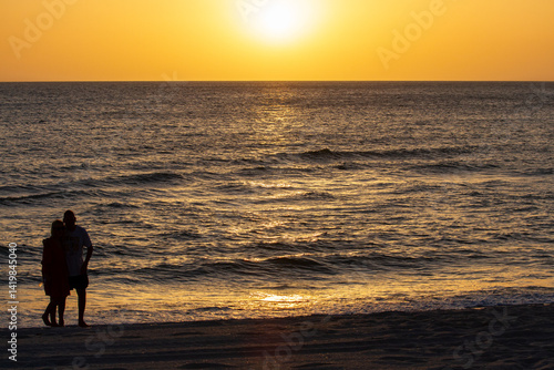 Sunsets Over Beaches, Palm Trees and Oceans