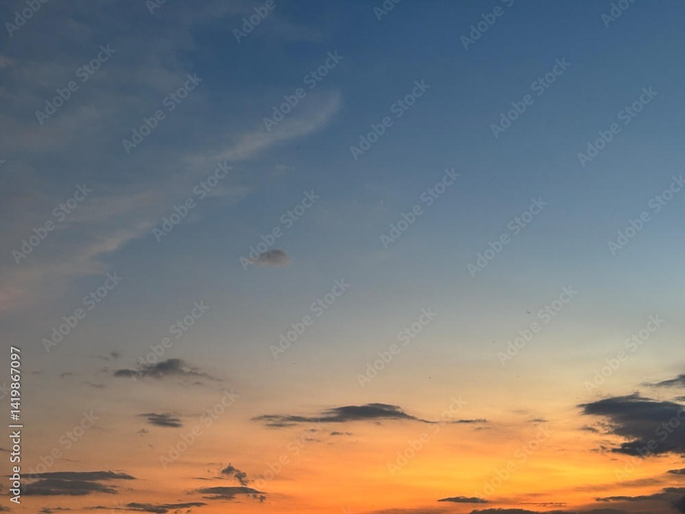 Beautiful sky with natural gradations. Thick clouds in the dusk sky on a winter night. Image of a cloudy sky in the afternoon. View of the night sky with golden light from the evening sun Beautiful sky with natural gradations. Thick clouds in the dusk sky on a winter night. Image of a cloudy sky in the afternoon. View of the night sky with golden light from the evening sun