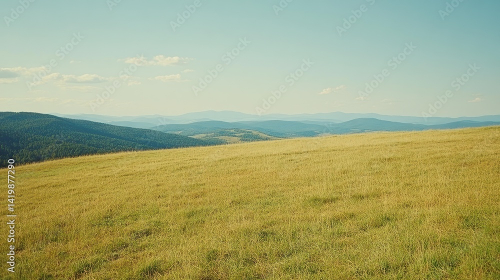 A sunny landscape featuring rolling hills and distant mountains A sunny landscape featuring rolling hills and distant mountains