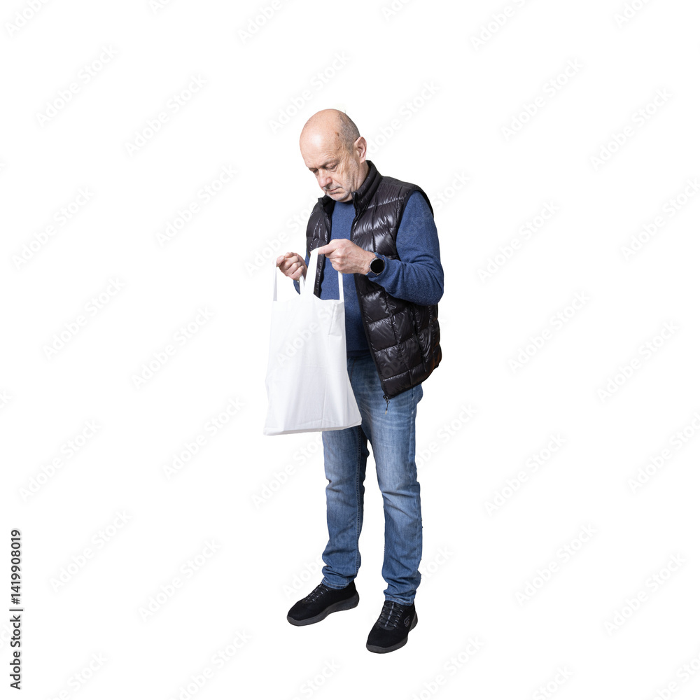 a man looking inside a canvas bag