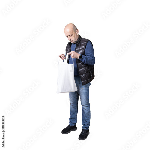 Obraz na płótnie a man looking inside a canvas bag w salonie