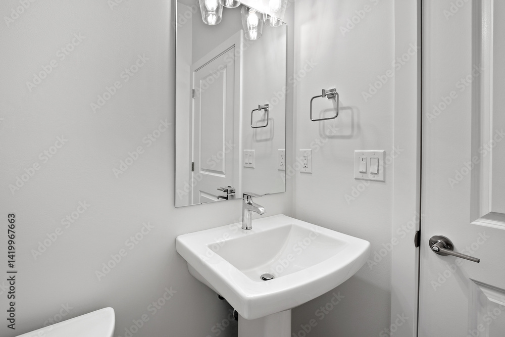 Obraz premium Bathroom with a white sink and toilet