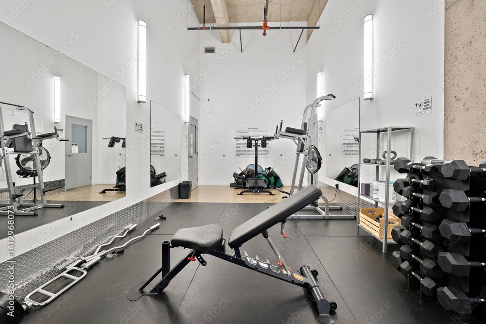 Fototapeta premium Gym with a black bench and a mirror