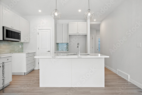Kitchen with a white island and a microwave above it
