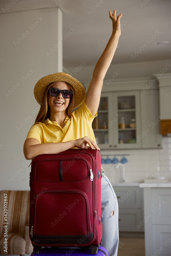 Happy joyful woman tourist rejoicing start of vacation posing for camera