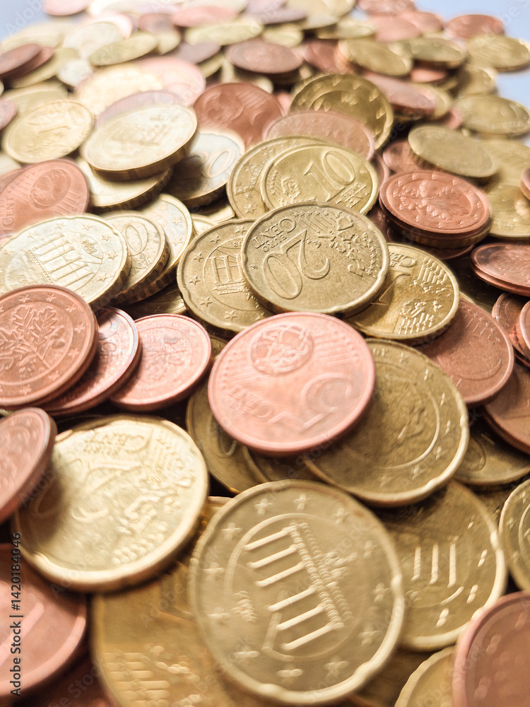 A Variety of Different Coins Piled Together, Displaying Their Unique Features and Value