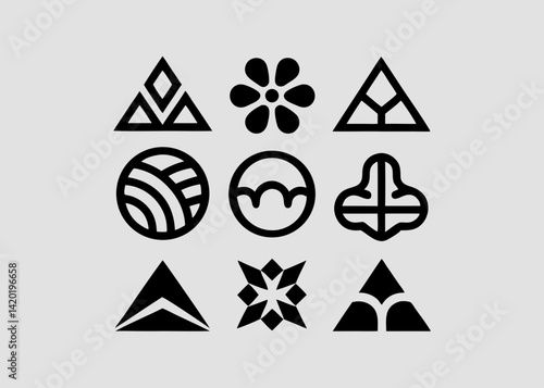 A collection of bold geometric shapes and floral motifs, showcasing a striking blend of simplicity and intricate detail in a minimalist black and white design.
