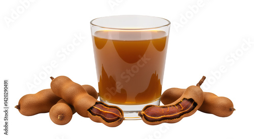 Refreshing tamarind juice in glass with fresh tamarind fruits around