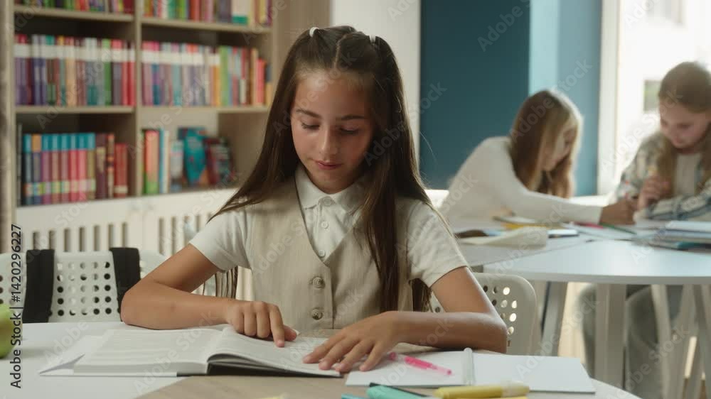 Clever little girl pupil at classroom studying reading book prepare study lesson schoolgirl kid child reader learning textbook library cognition read in school academy smiling teen student education Clever little girl pupil at classroom studying reading book prepare study lesson schoolgirl kid child reader learning textbook library cognition read in school academy smiling teen student education