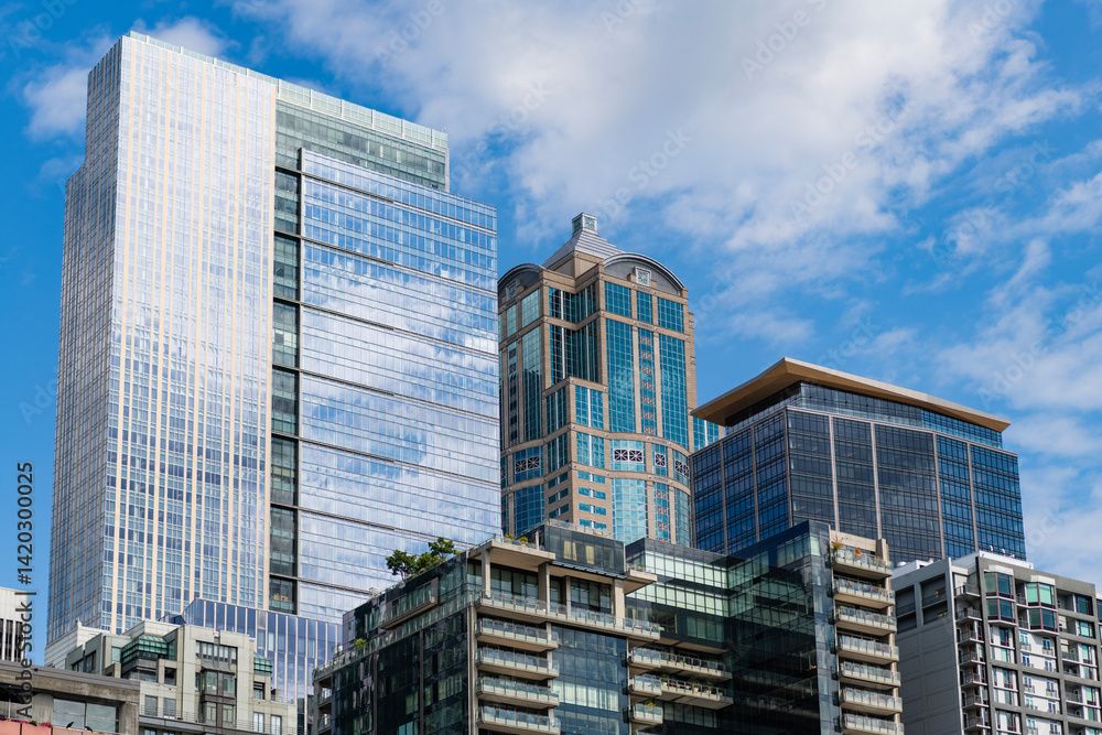 Obraz premium City architecture. Office building in business district. Residential building. Skyscraper building architecture. Skyscraper modern cityscape. Urban cityscape. Skyscraper in city downtown