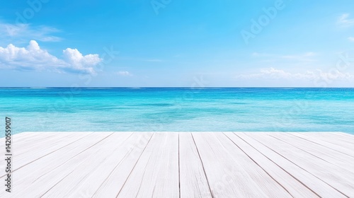 Tranquil beach scene with white wooden deck