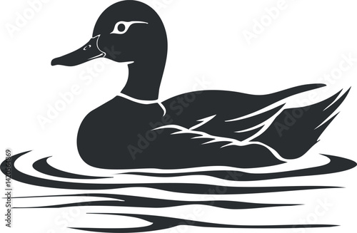 A black silhouette of a duck swimming gracefully on a calm water surface.