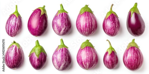 Obraz na płótnie Close-up of fresh purple eggplants arranged on a clean white surface with natural lighting. w salonie