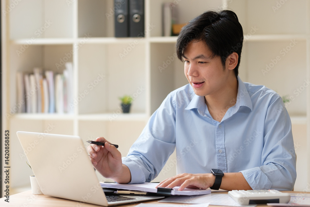 Businessman using laptop and planning business strategy at office desk. Businessman using laptop and planning business strategy at office desk.