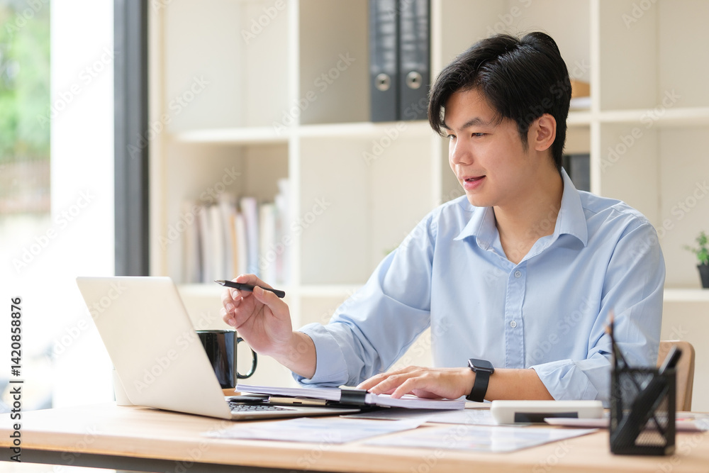 Businessman using laptop and planning business strategy at office desk. Businessman using laptop and planning business strategy at office desk.