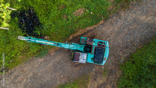 Fotografie Aerial scenery of lone excavator at abandoned rock and sand mine in the morning