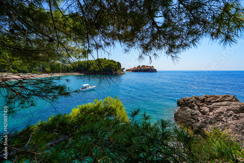 Obraz na płótnie Sveti Stefan, a medieval village located on a small island connected to the mainland by a narrow tombolo (sandy isthmus) in the bay of Budva along the Adriatic Coast, Montenegro w salonie