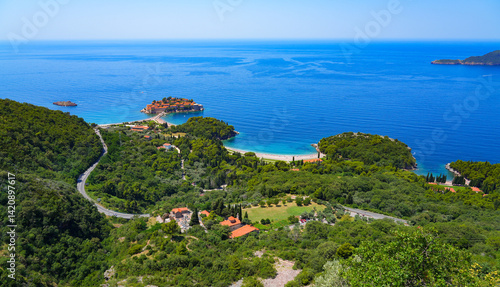 Obraz na płótnie Aerial view of Sveti Stefan, a medieval village located on a small island connected to the mainland by a narrow tombolo (sandy isthmus) in the bay of Budva along the Adriatic Coast, Montenegro w salonie