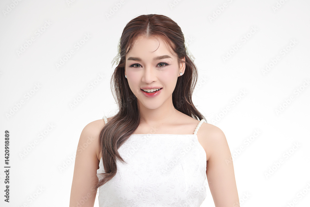 A beautiful young Asian woman with clean, fresh skin against a white background. Skincare, facial treatment, cosmetology, beauty, and spa. An elegant portrait of an Asian woman. A beautiful young Asian woman with clean, fresh skin against a white background. Skincare, facial treatment, cosmetology, beauty, and spa. An elegant portrait of an Asian woman.
