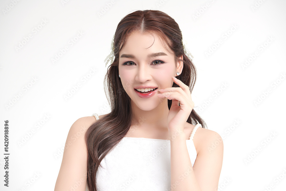 A beautiful young Asian woman with clean, fresh skin against a white background. Skincare, facial treatment, cosmetology, beauty, and spa. An elegant portrait of an Asian woman. A beautiful young Asian woman with clean, fresh skin against a white background. Skincare, facial treatment, cosmetology, beauty, and spa. An elegant portrait of an Asian woman.