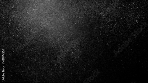 Black matte textured background with floating dust particles illuminated by soft light Vintage black and white noise texture. Soft gray texture with subtle variations, Abstract vector texture 