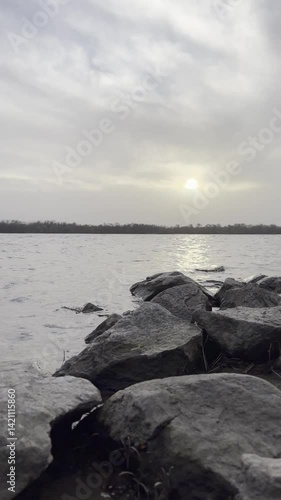 Sunset Sky with Clouds Reflected on Water Surface