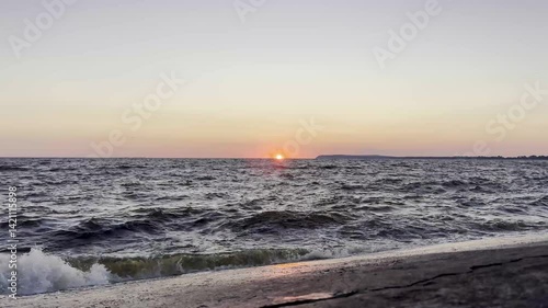 Sunset Sky with Clouds Reflected on Water Surface