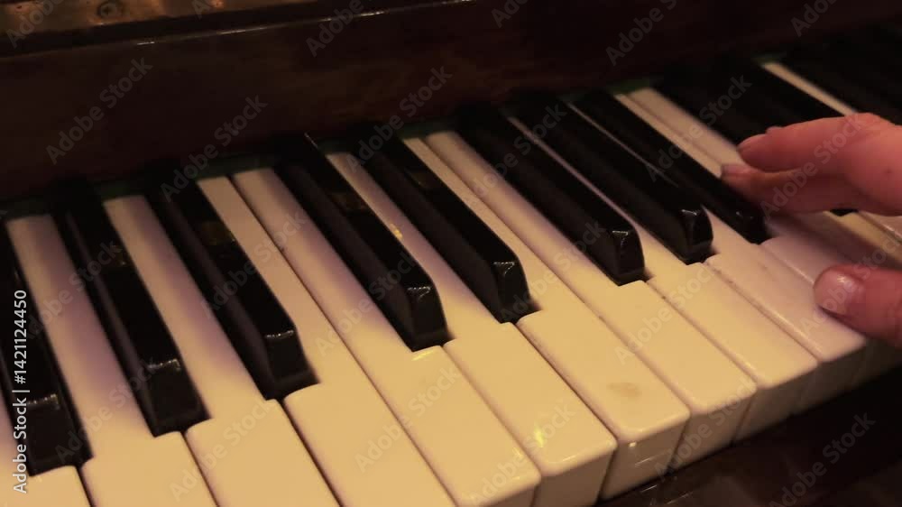 woman playing a scale on the piano, close-up of keys and hands woman playing a scale on the piano, close-up of keys and hands