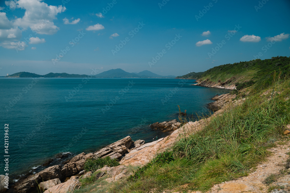 The sky above the island was a brilliant blue, with clouds drifting lazily over the ocean, as the clear water met the beach, creating a perfect natural paradise by the sea. The sky above the island was a brilliant blue, with clouds drifting lazily over the ocean, as the clear water met the beach, creating a perfect natural paradise by the sea.