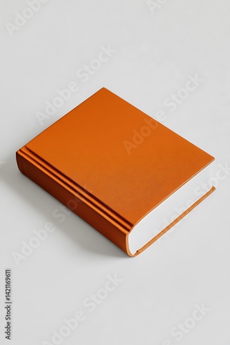 Obraz na płótnie Orange Book Isolated On White Background With Textured Surface w salonie