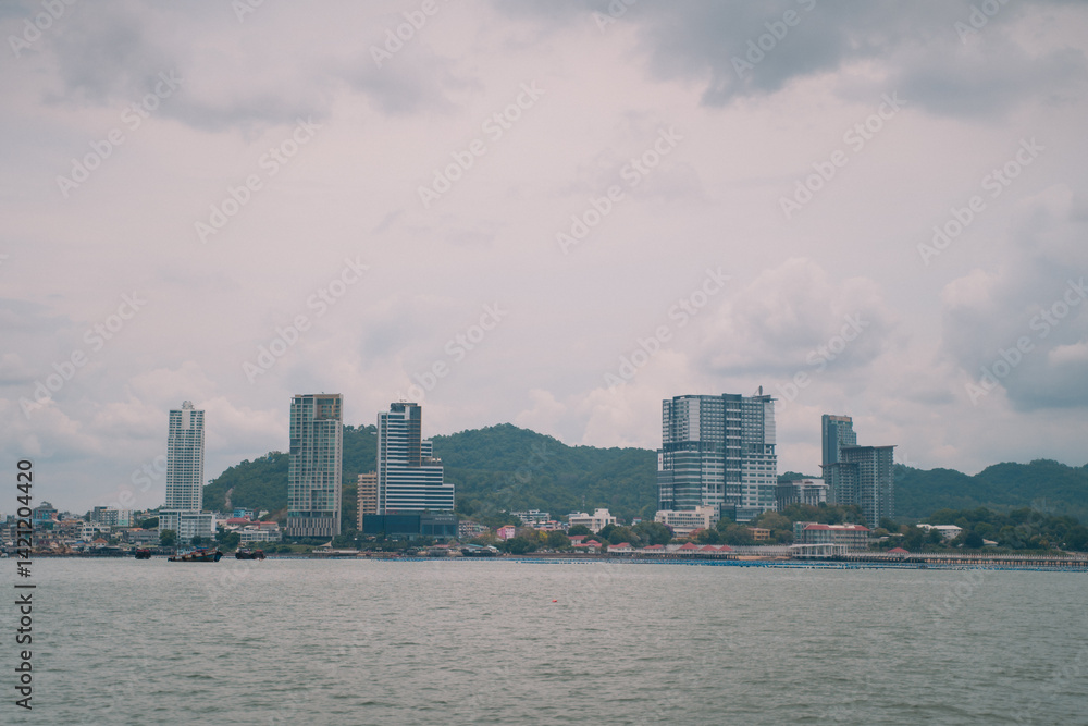 The city's skyline blends striking architecture and tall buildings beneath a vast sky, offering a sea view where water meets land a perfect panorama for travel tourism. The city's skyline blends striking architecture and tall buildings beneath a vast sky, offering a sea view where water meets land a perfect panorama for travel tourism.