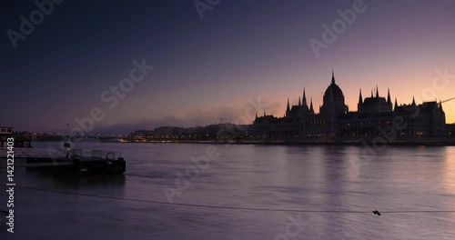Budapest, Hungary - October 16, 2024: Violet Dawn: Parliament’s Gothic Spires in the Pre-Morning Hush. Timelapse, slide transition.