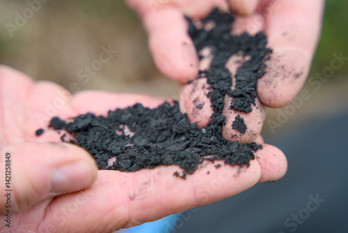 Close-up of biochar, produced through wood pyrolysis, a sustainable solution for carbon sequestration. Ideal for themes around CO2 reduction,, and sustainable farming, Carbon farming