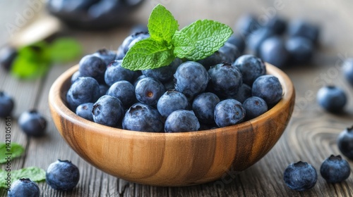 Wallpaper Mural Fresh blueberries in rustic wooden bowl with mint leaves on wooden table – close-up of juicy blue berries for healthy eating, organic fruit background, natural snack or dessert concept
 Torontodigital.ca