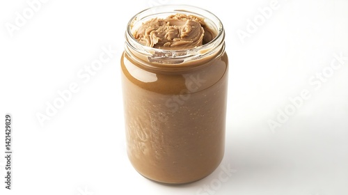 A jar of peanut butter sitting on a white surface in the studio