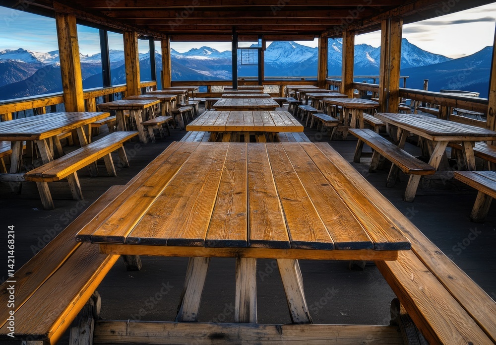 Mountaintop dining area with wooden tables and benches Mountaintop dining area with wooden tables and benches