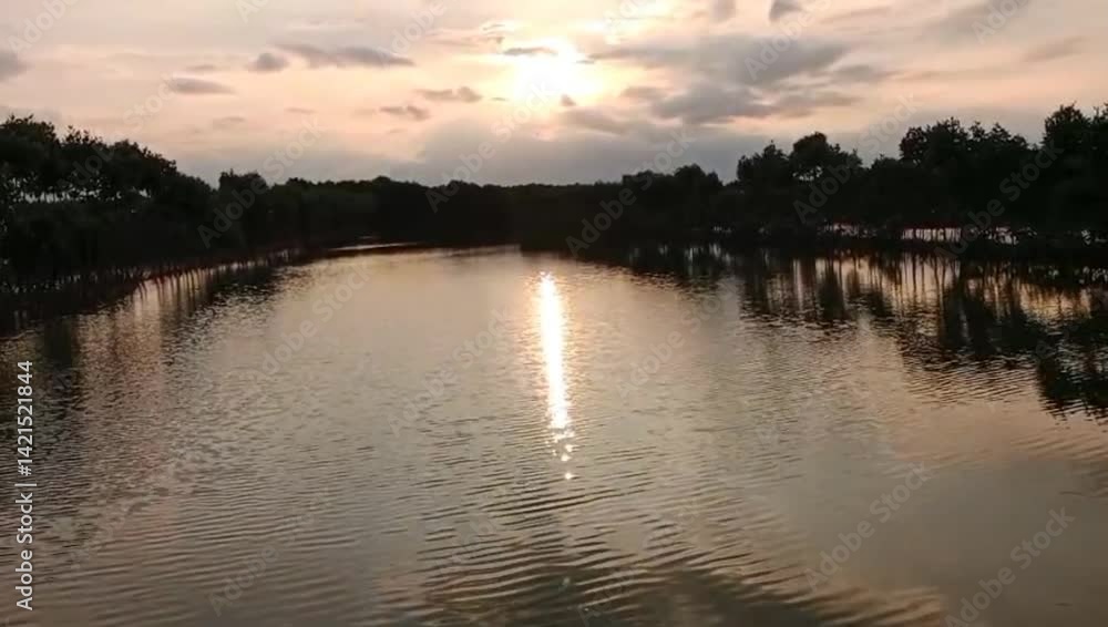 Sunset over the river atmosphere on the edge of the lake is very beautiful Sunset over the river atmosphere on the edge of the lake is very beautiful
