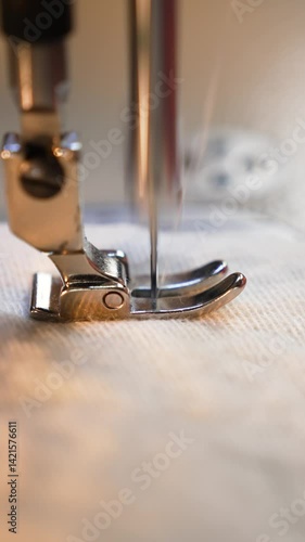 sewing machine running close-up in slow motion sewing machine needle close-up sewing things  vertical video