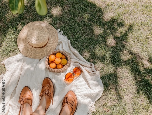 Obraz na płótnie Picnic blanket in grass with fruit and accessories w salonie