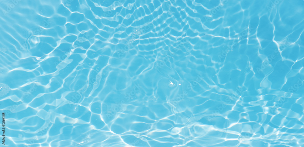 Obraz premium Blue water with ripples on the surface. Defocus blurred transparent blue colored clear calm water surface texture with splashes and bubbles. Water waves with shining pattern texture background.