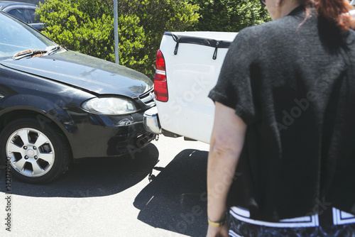 Collision of cars close up with onlooker