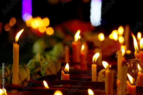 Soft Glows of Candlelight with Lotus Flowers in a Dark Setting