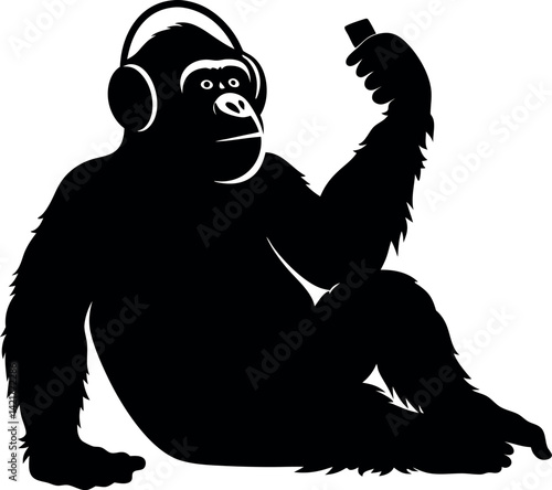 Black Gorilla Silhouette Sitting Holding Device Wearing Headphones on White Backdrop