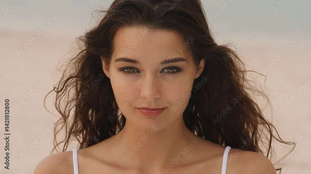 A close-up shot of a serene woman in a white bikini looking directly into the lens. Ideal for fashion, lifestyle, beauty, and emotional storytelling content in high quality. A close-up shot of a serene woman in a white bikini looking directly into the lens. Ideal for fashion, lifestyle, beauty, and emotional storytelling content in high quality.
