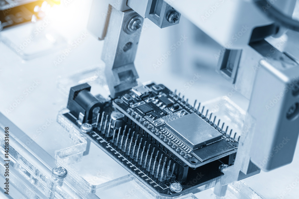 Close up scene the micro circuit board assembly process by robotic arm in the light blue scene. Close up scene the micro circuit board assembly process by robotic arm in the light blue scene.